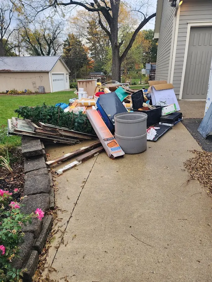 Dumpster being loaded with debris for Commercial Dumpster Rental in Marion